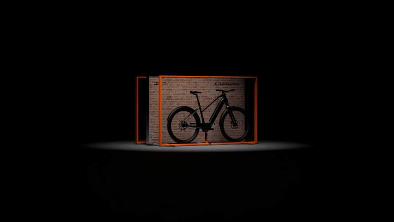 a bicycle is sitting inside of a brick box .