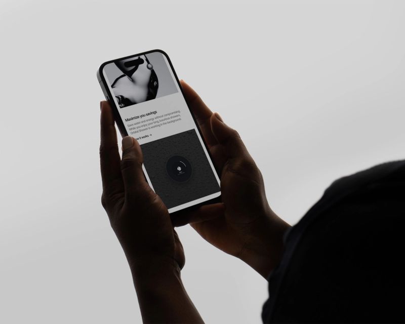 a person is holding a cell phone in their hands .