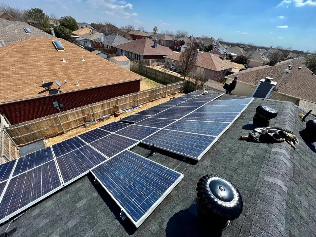 Solar panels partly removed from a roof during a detach and reset