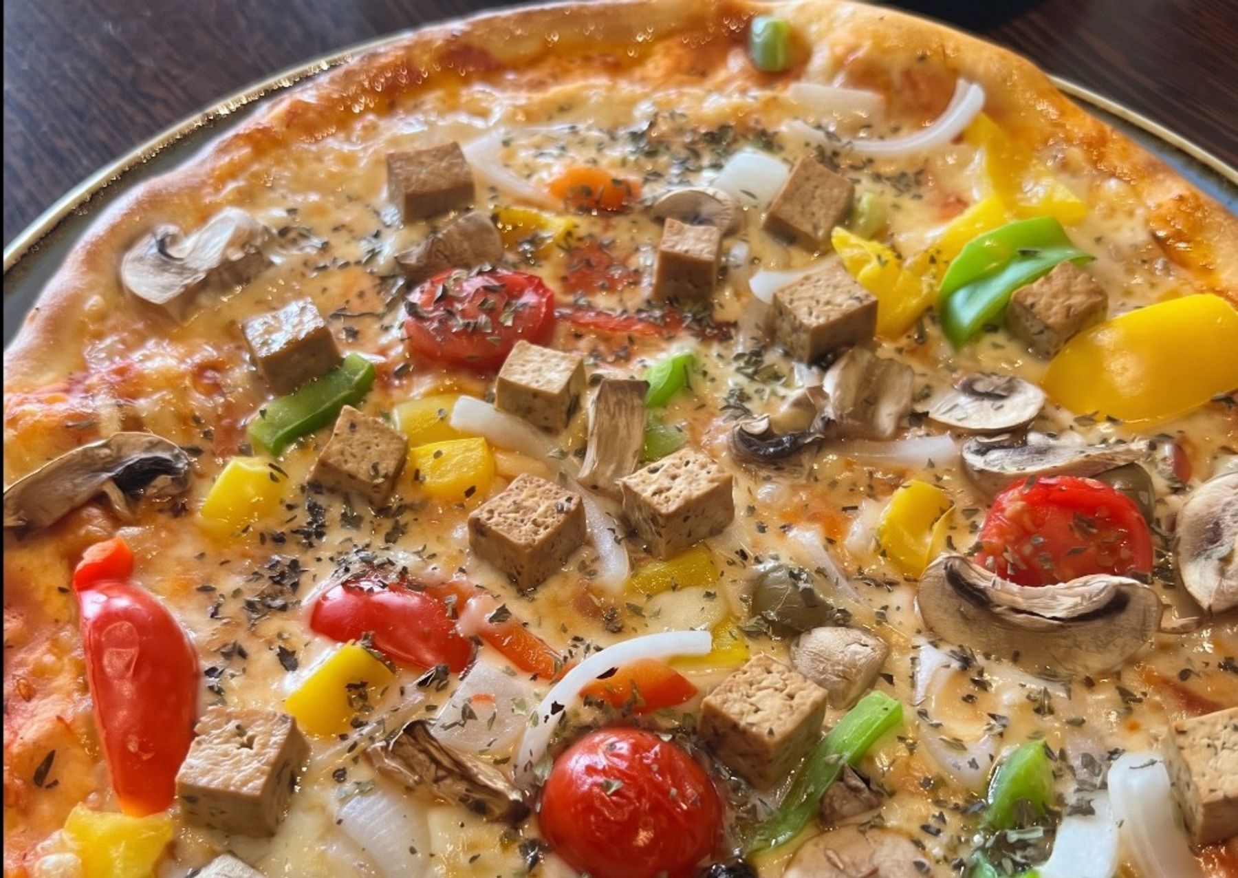 Plant-based pizza topped with diced dougan