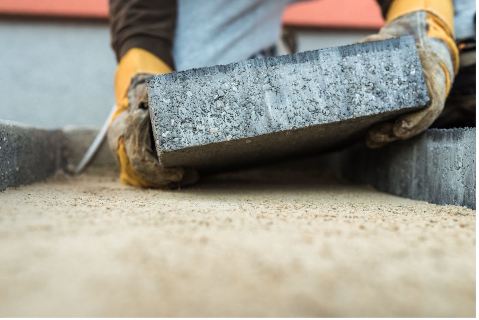 A concrete brick being put in place.