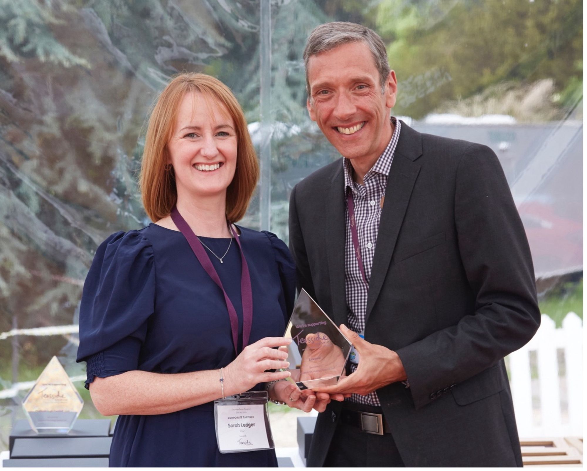 Lexonik CEO, Sarah Ledger accepting an award from Teesside Hospice for our work with them