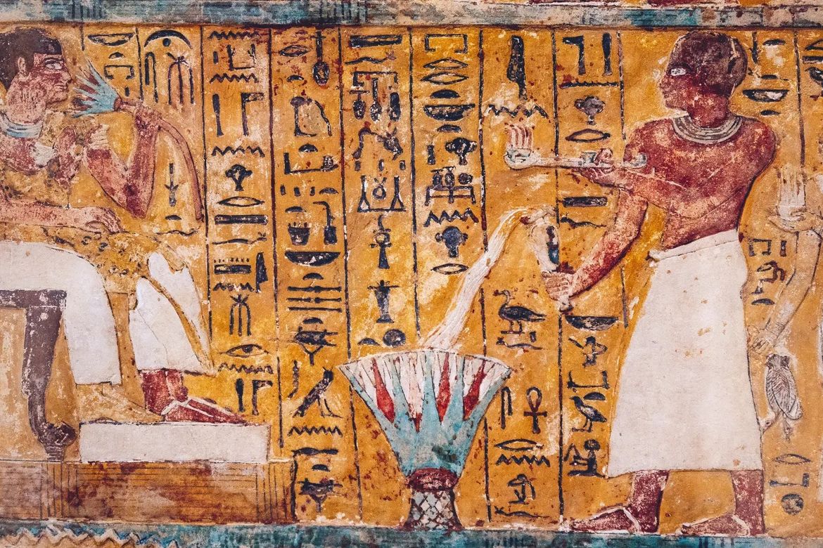 An ancient Egyptian painting on a wall.