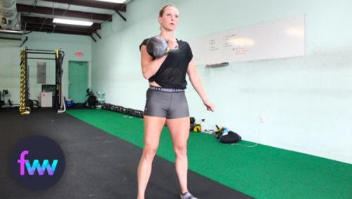 Kindal holding a kettlebell