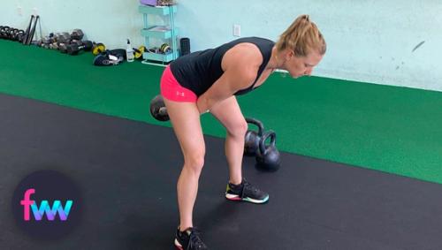 Kindal showing the bottom of a kettlebell swing.