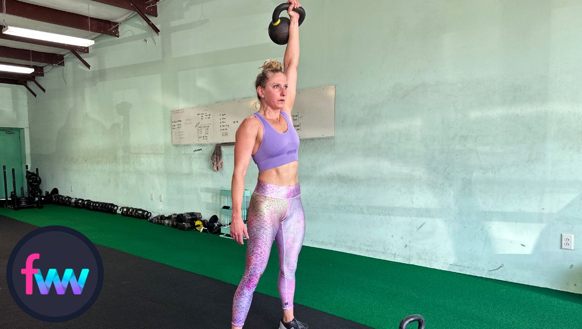Kindal is at the top of the kettlebell snatch and fully extended with good balance on her feet.