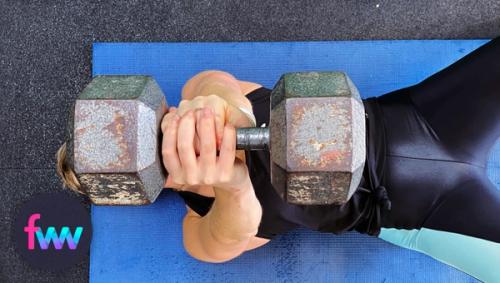 Kindal showing a really cool way to hold the dumbbell for a floor press.