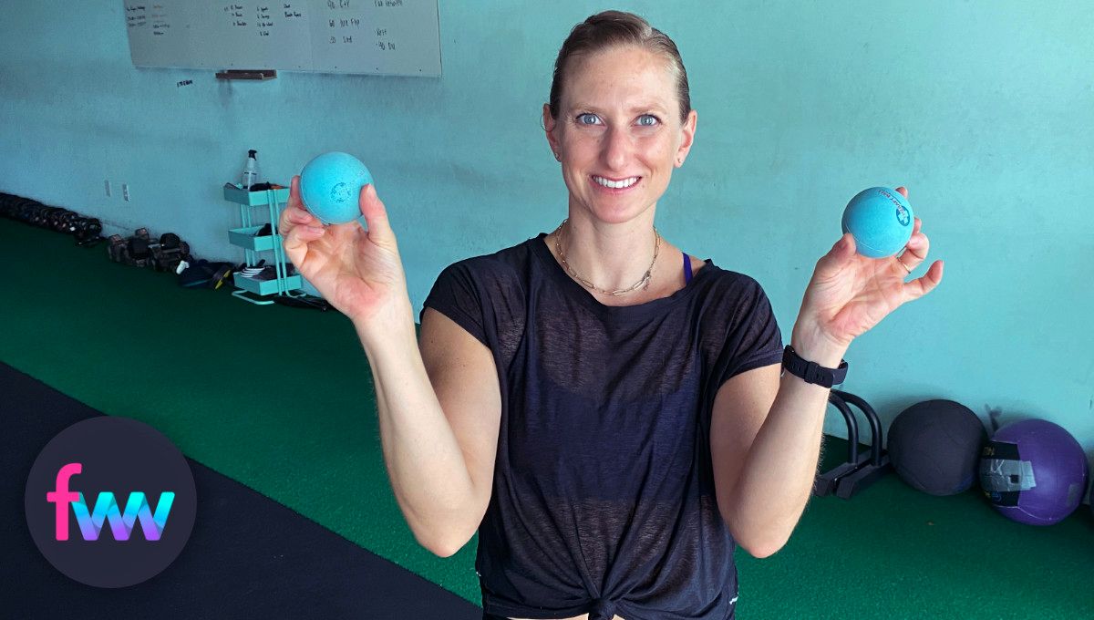 Kindal holding the smaller therapy balls from Jill Miller.
