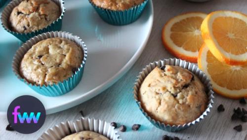 A plate of orange chocolate chip muffins