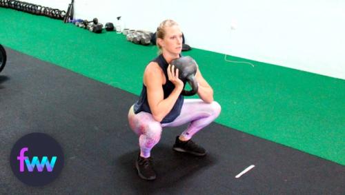 Kindal doing a cannonball kettlebell squat