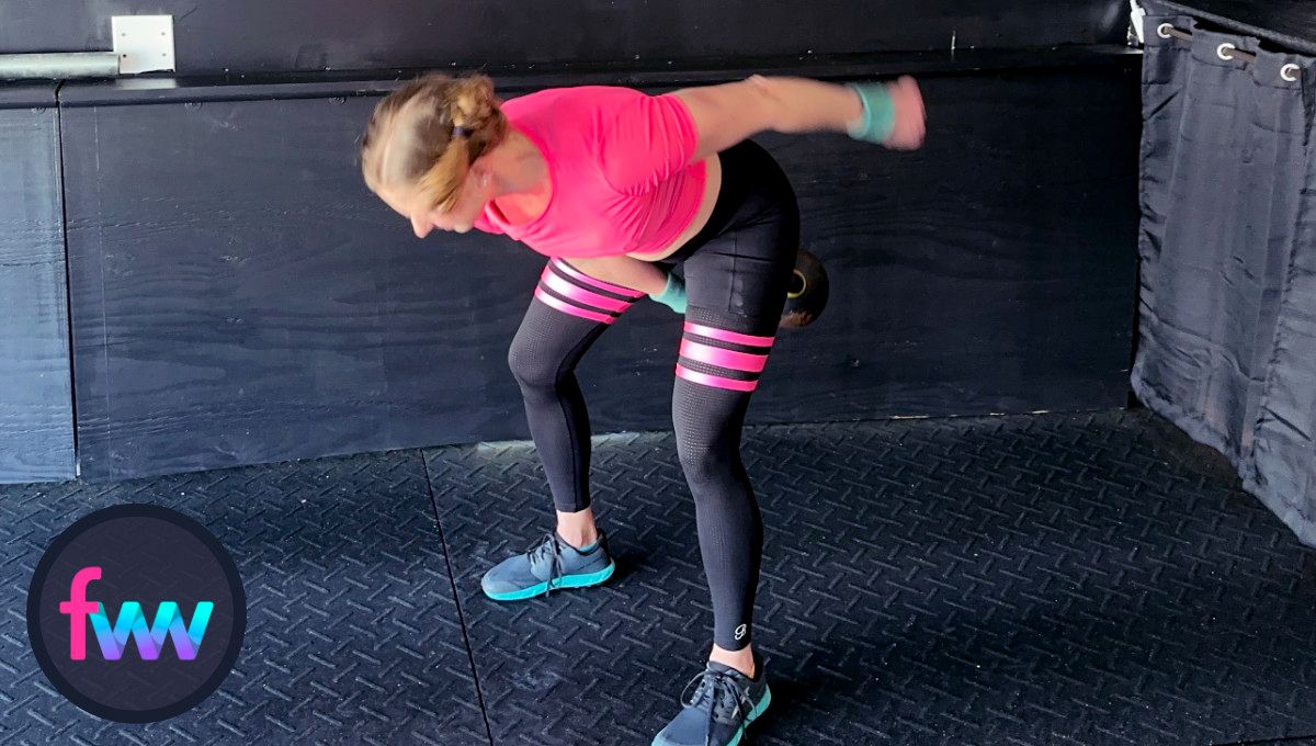 Kindal is in the loaded position of the snatch with her hips back and her balance is really strong.