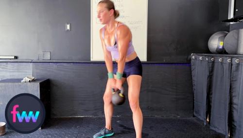 Kindal is nearly standing straight up as the kettlebell comes through her legs.