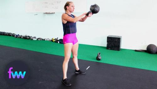 Kindal at the top of her kettlebell swing