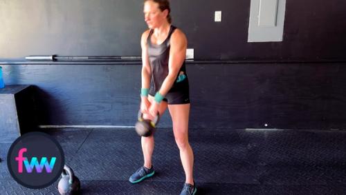 Kindal firing her hips and you can see as the kettlebell passes her legs she is nearly standing straight up.