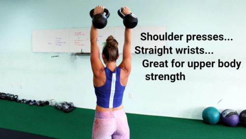 Kindal doing shoulder presses which are great for upper body strength.