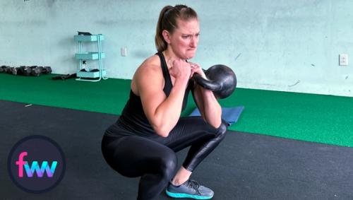 Kindal is bracing hard at the bottom of a squat preparing to get 2 to 3 more reps and push her strength to another level.