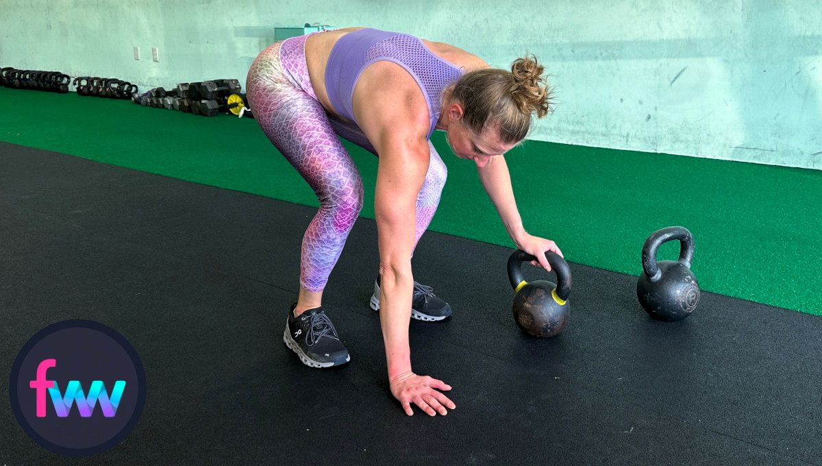 Kindal going into the tuck position of the burpee and notice her hand is on the kettlebell so she can move faster.