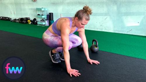 Kindal going down into a burpee tuck so she can then jump back into a plank and pushup position.