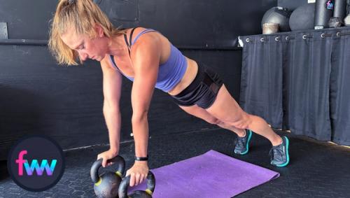 Kindal at the start of kettlebell renegade rows. Notice how she is balancing over her kettlebells and they are a little closer together.