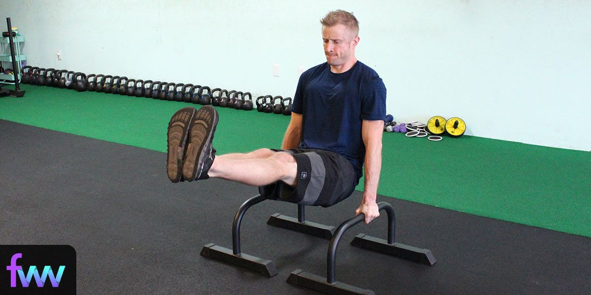 Dan doing an lsit on the parallettes which is bodyweight training