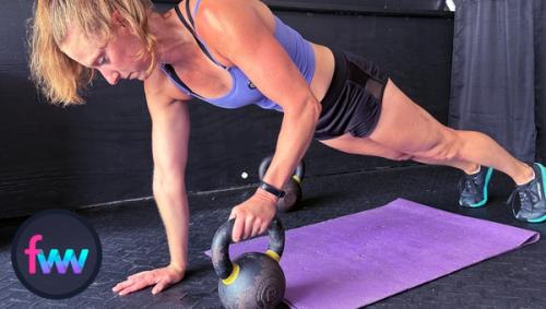 Kindal at the start position of a kettlebell renegade row. You can see the limited range of motion she will have but her body remains engaged and locked out.