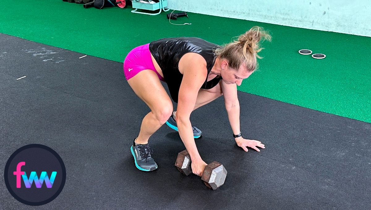 Kindal completes the pushup and jumps back in and gets ready for the snatch part of the burpee.