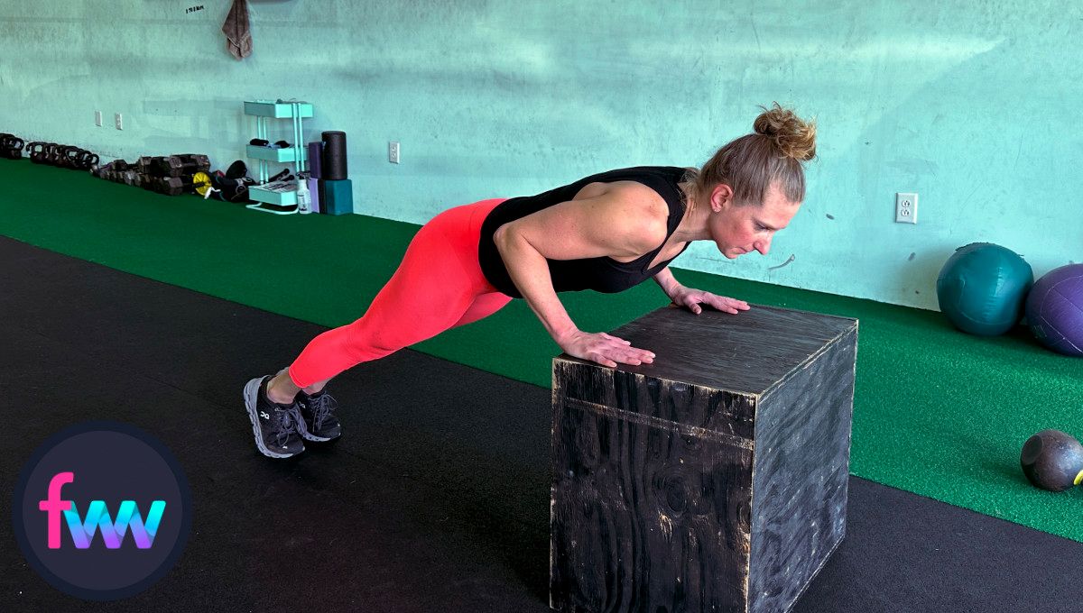 Kindal showing how to do a great box burpee pushup with a tight core and straight body.