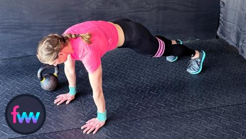 Kindal jumps back into the top of a pushup plank ready to do her pushup.