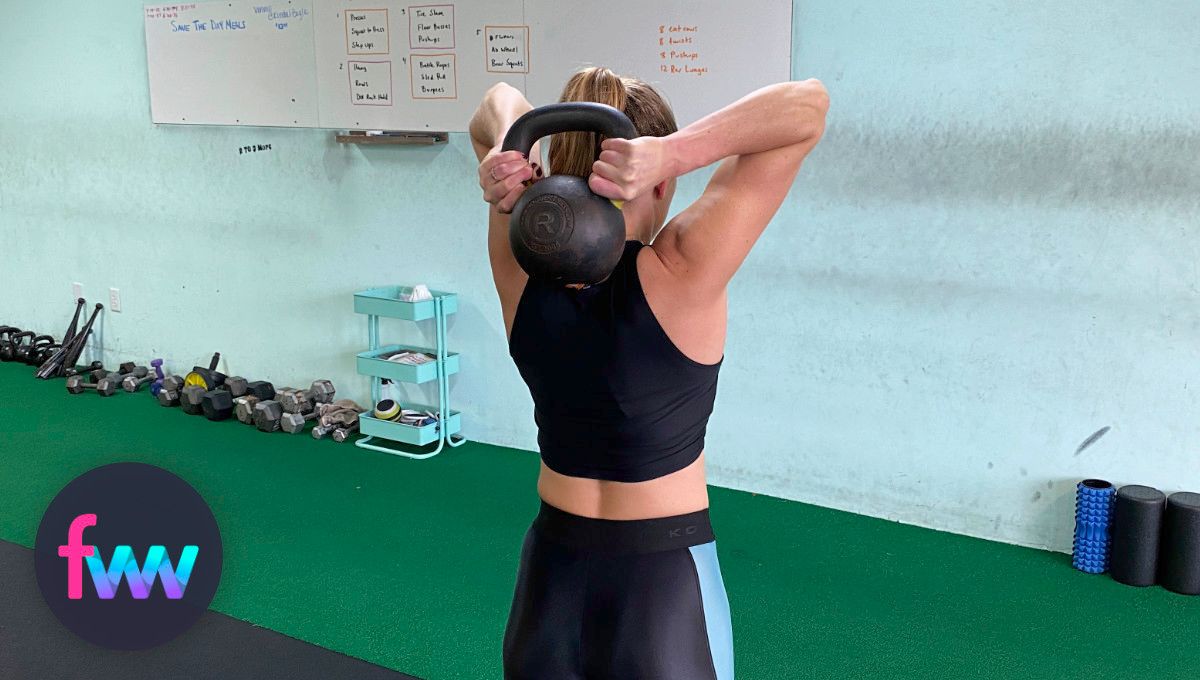 Kindal in the behind the head position of the kettlebell halos.
