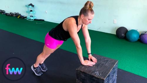 Kindal showing how to do pushups off a high box.