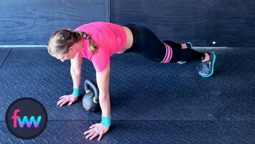 Kindal jumps back into the top of the pushup plank landing with control and an engaged body.