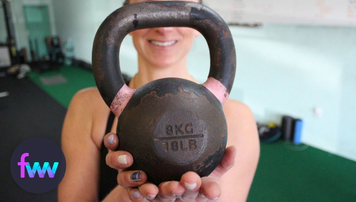 Kindal holding one of our 18 lb kettlebells.