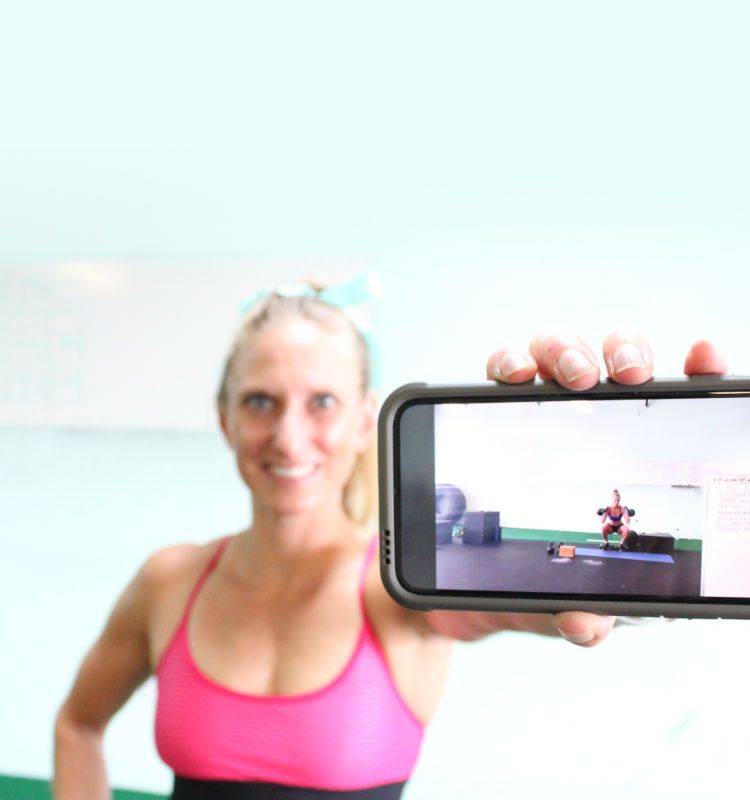 Kindal doing a live workout in our group Kindal doing squats while filming a live workout