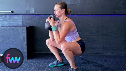 Kindal at the bottom of the goblet squat. As she squatted down she focused on twisting her feet into the ground and keeping her torso tall.