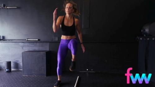 Kindal doing high knees over a bar and working on her agility to move laterally while still getting her knees up high and moving really fast.