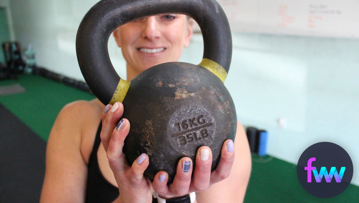 Kindal holding one of our 35 lb kettlebells.