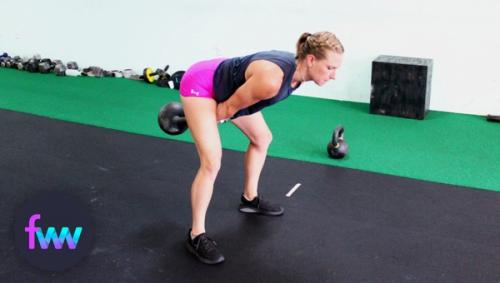 Kindal hiking the kettlebell back for a swing