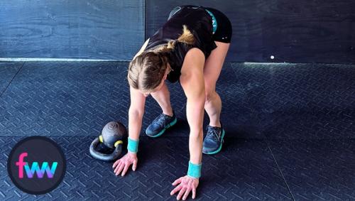 Kindal down in the burpee tuck position keeping her body position close to the kettlebell.