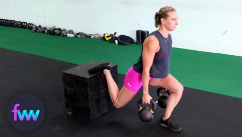 Kindal doing a double suitcase split squat