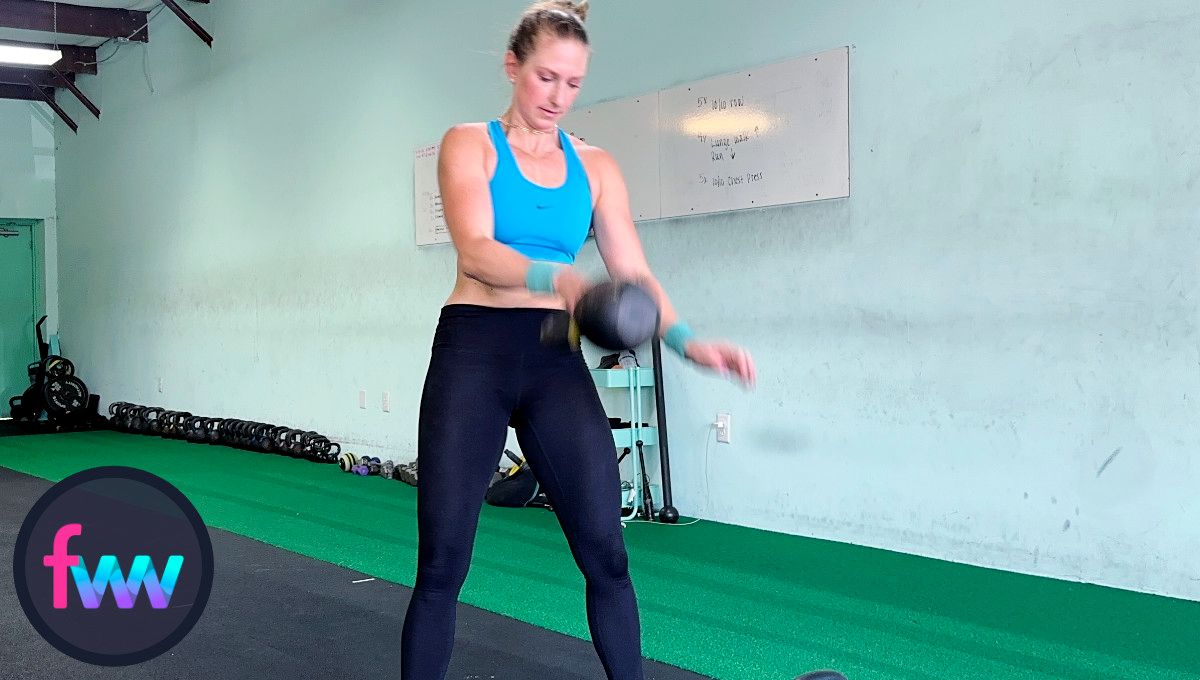 Kindal tosses the kettlebell off her shoulder and makes sure that it falls straight down and not at an angle. 
