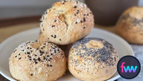 A stack of high protein bagels with different toppings.