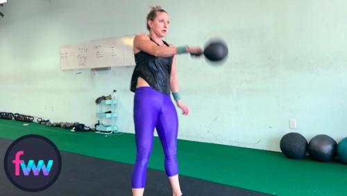 Kindal in the part of the kettlebell snatch where she redirects the snatch so the kettlebell goes straight up and then she will punch around it.