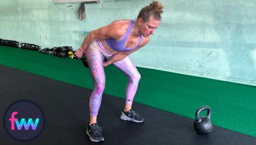 Kindal in the loaded position of the kettlebell snatch so she can fire her hips as hard as possible while keeping balance.