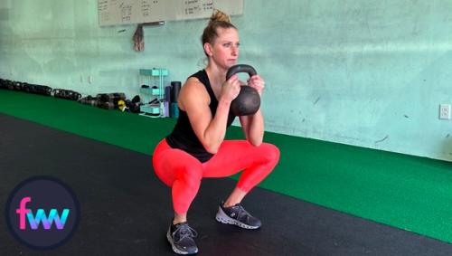 Kindal at the bottom of the goblet squat fully engaged so she can move with speed.