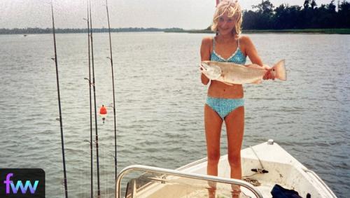 Kindal when she was young and tiny holding up a fish