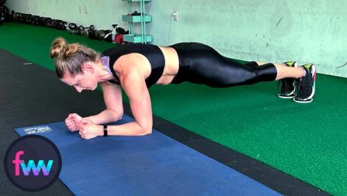 Kindal is at the start of the lateral plank walk and she is using sliders.