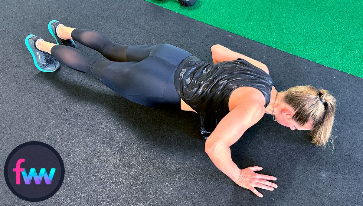 Kindal at the bottom of lizard pushups with her arms switched. You can see the left elbow is going straight back while the right is going out to the side.