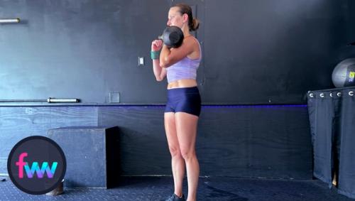 Kindal standing in the top of the racked lunge. But her body is engaged and she's slightly twisting the front foot into the ground to prep for the step back.