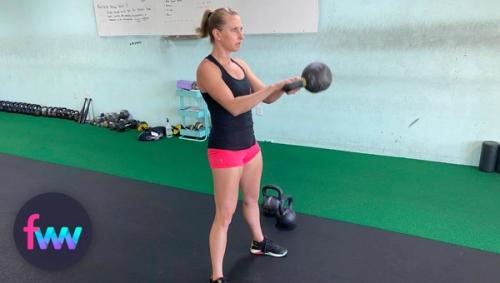 Kindal showing the top of a kettlebell swing.