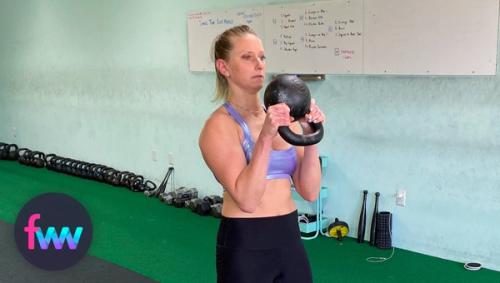 Kindal squeezing at the top of the kettlebell curl.